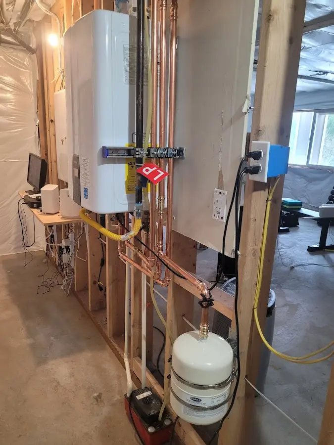 Licensed plumber repairing a kitchen sink in Westchester